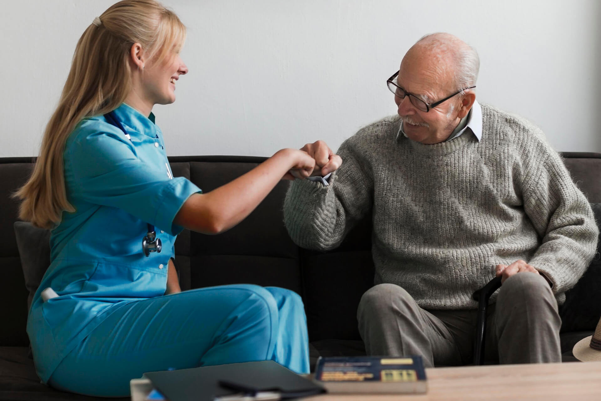 Trusted Home Care Experts in Florida - Sunshine Home Care Services Caregiver and senior sharing a friendly fist bump at home